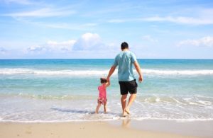 Dad and daughter on beach