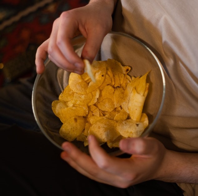 Person eating chips
